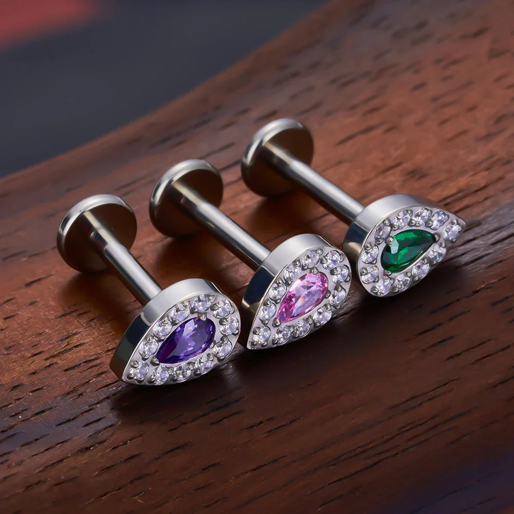 Feminine and classy medusa piercing with clear pink purple blue black