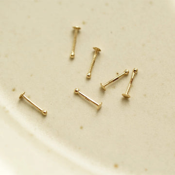 Nose bone stud 14K gold tiny and minimalist Rosery Poetry