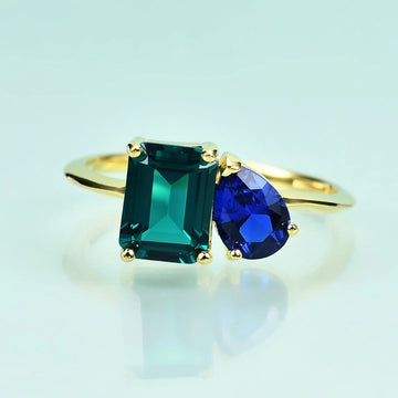 Toi et moi ring emerald and sapphire