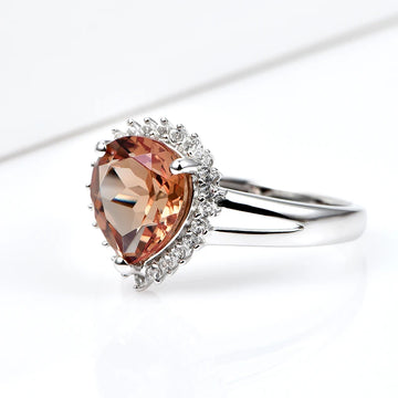 Silver zultanite ring with a pear-shaped zultanite and clear cz stones