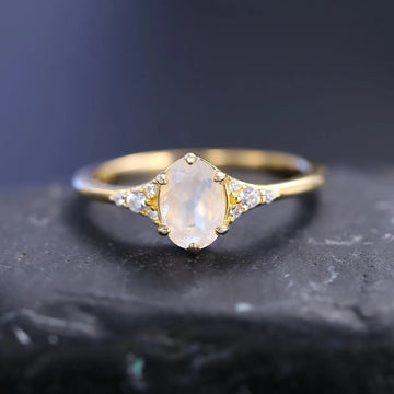 Moonstone and diamond engagement ring with an oval moonstone