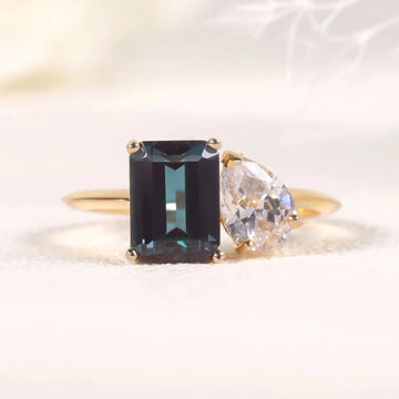 You and me ring with a color-changing alexandrite stone and a clear cz