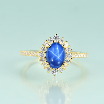 Anillo de bodas Princesa Diana de oro de 14 quilates con mini zafiro estrella azul